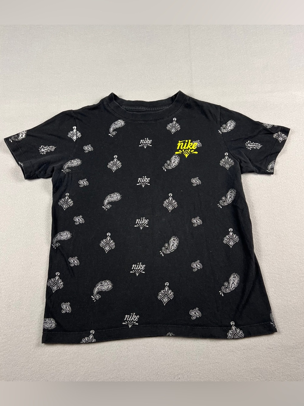 Nike Black Short Sleeve Tee with White Paisley Print and Yellow Logo